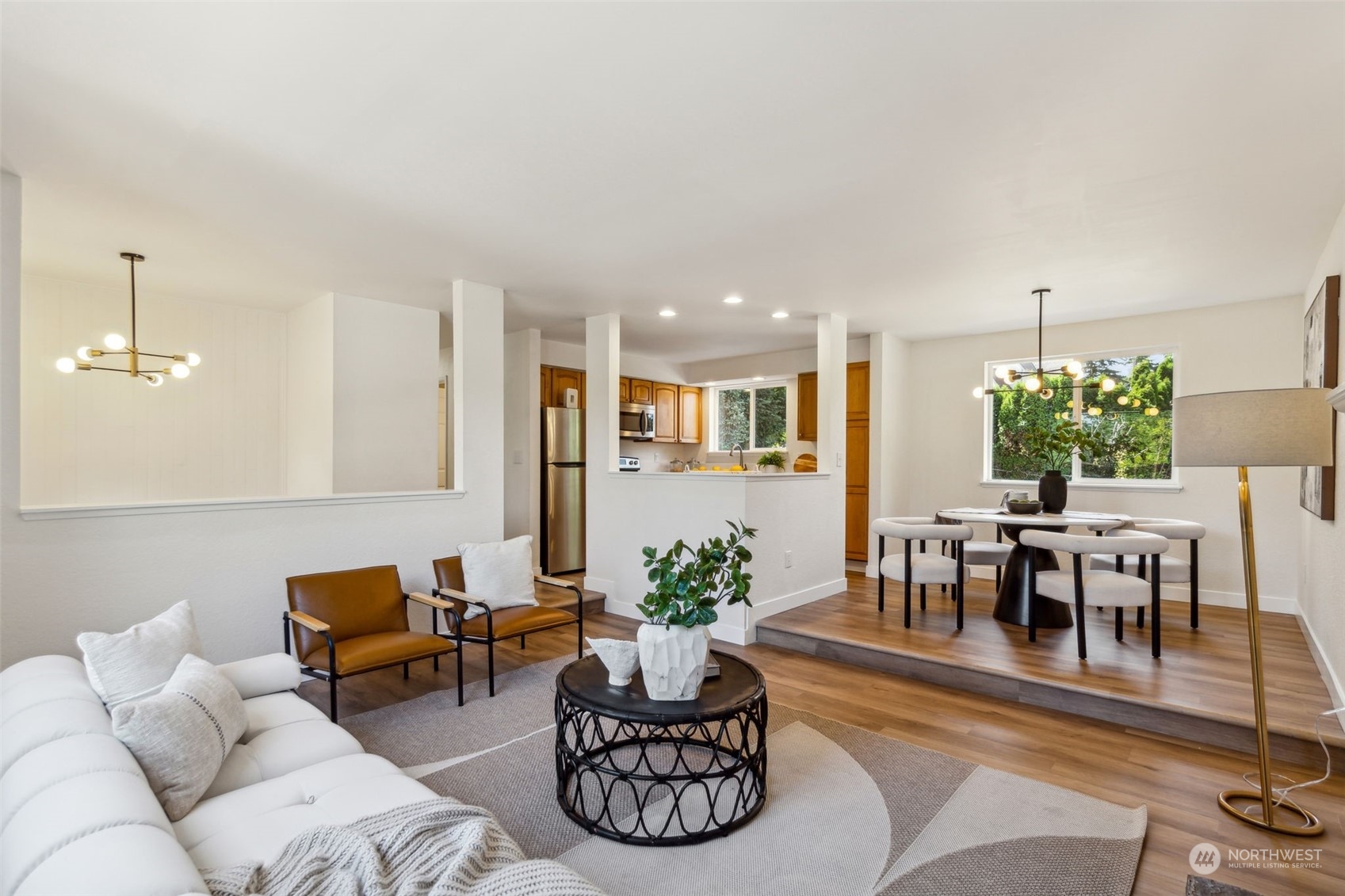 1901 Northeast 17th Place Renton, WA 98056 - Photo 4 of 40 a living room with furniture potted plant and kitchen view
