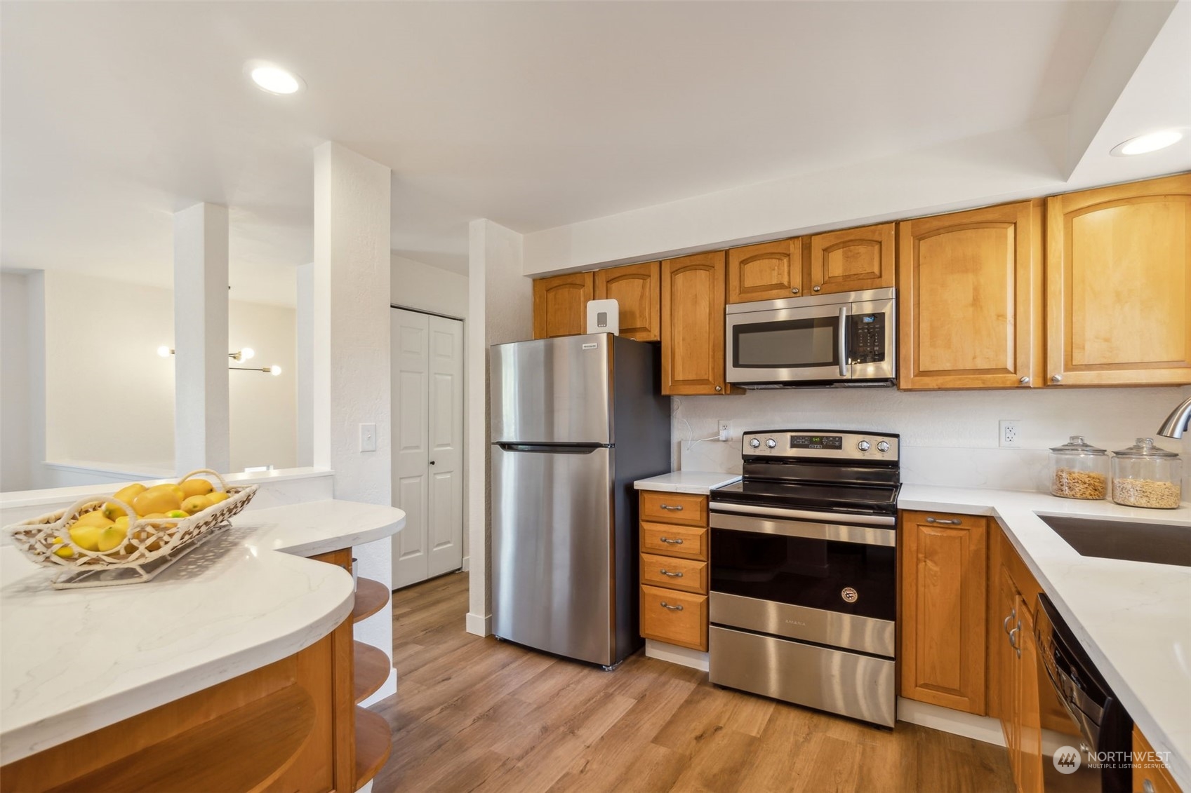 1901 Northeast 17th Place Renton, WA 98056 - Photo 10 of 40 a kitchen with stainless steel appliances a refrigerator stove and microwave