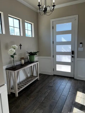 a bedroom with furniture and a potted plant