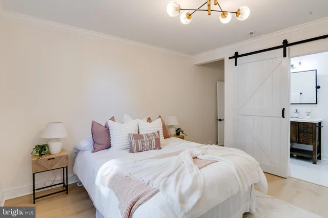 a bedroom with a bed and a tv