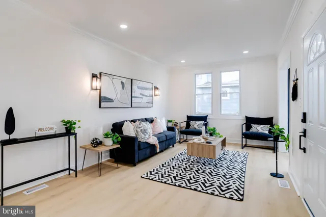 a living room with furniture rug and window