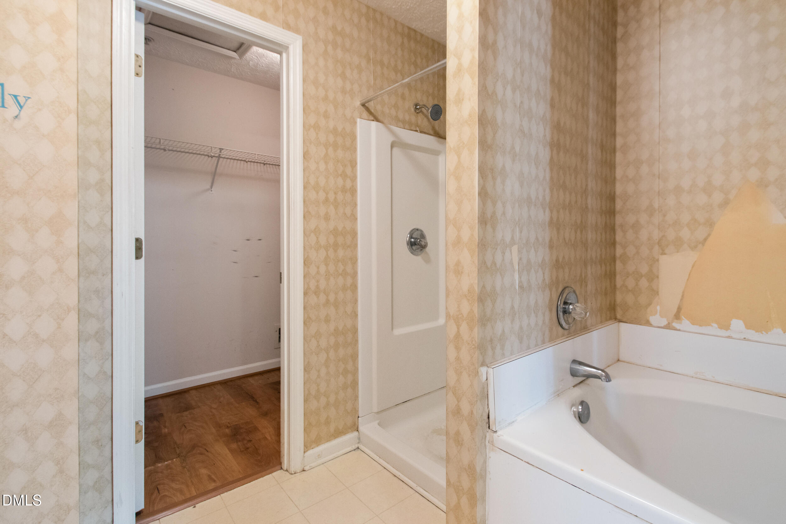 340 Bubble Creek Court, Unit 11 Fayetteville, NC 28311 - Photo 21 of 28 a bathroom with a bathtub and a shower