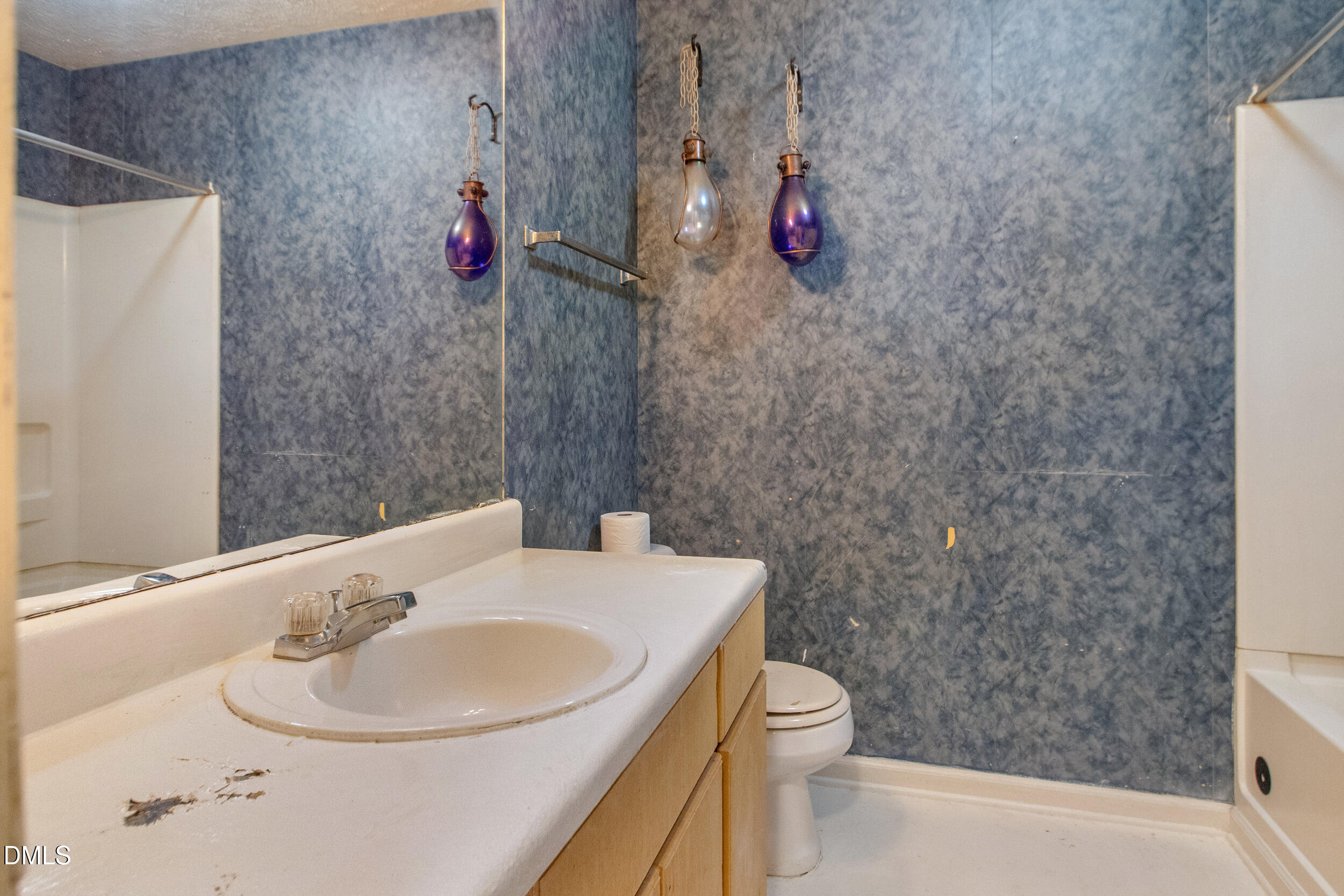 340 Bubble Creek Court, Unit 11 Fayetteville, NC 28311 - Photo 23 of 28 a bathroom with a sink a toilet and shower