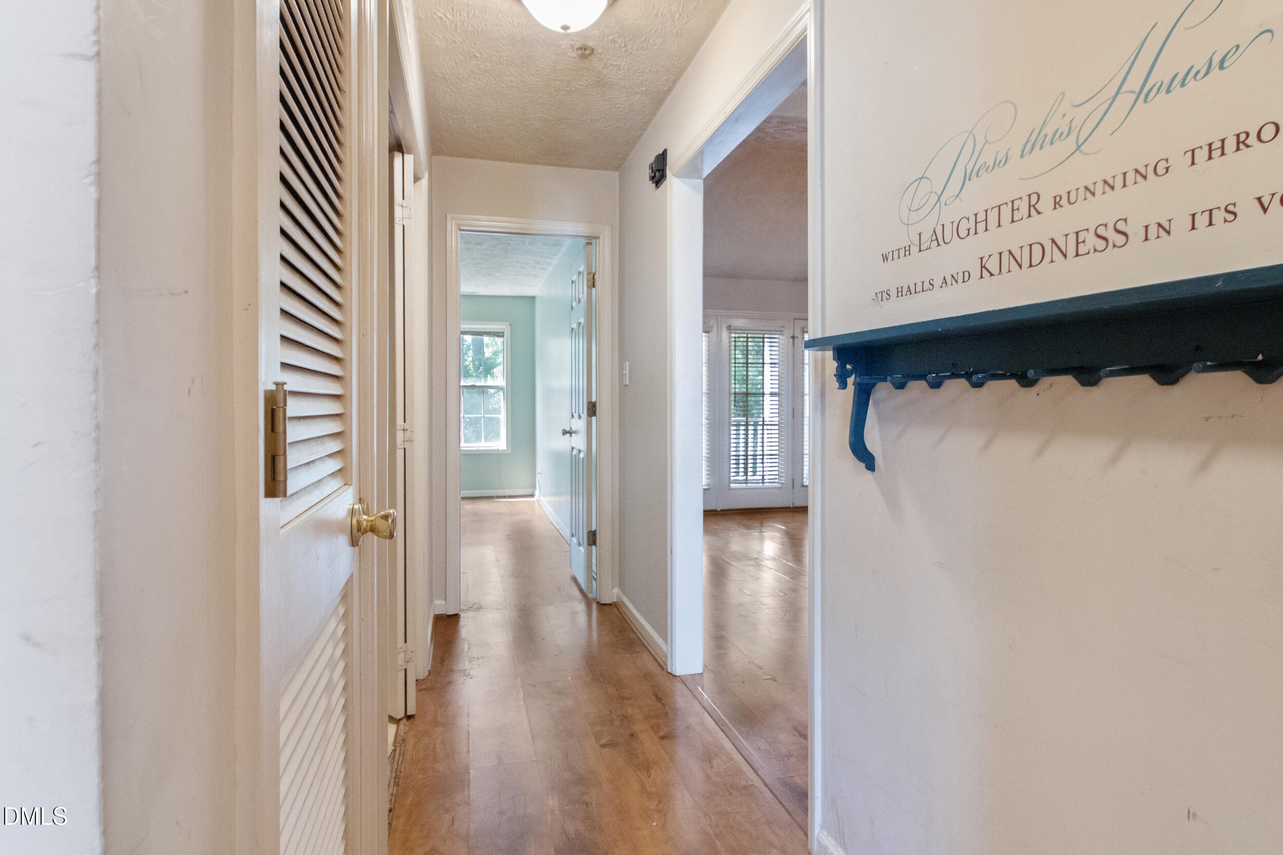 340 Bubble Creek Court, Unit 11 Fayetteville, NC 28311 - Photo 5 of 28 a view of a hallway with wooden floor