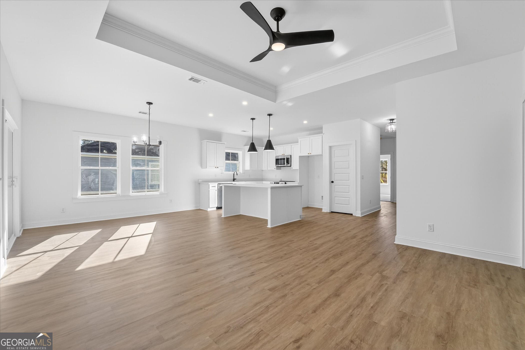 1072 Cottage Way Darien, GA 31305 - Photo 2 of 13 a view of a kitchen with a dishwasher cabinet and a fireplace