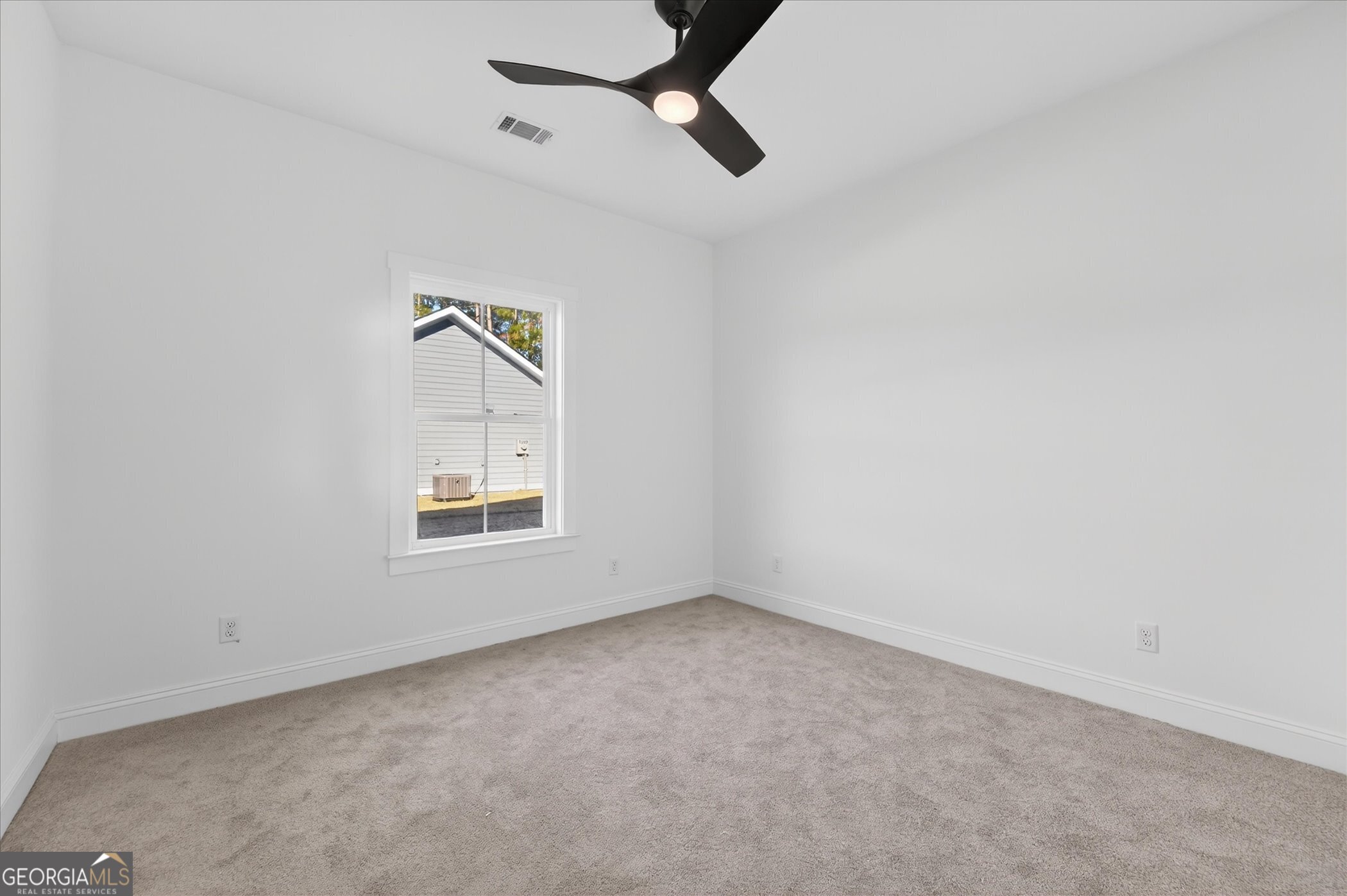 1072 Cottage Way Darien, GA 31305 - Photo 9 of 13 an empty room with windows