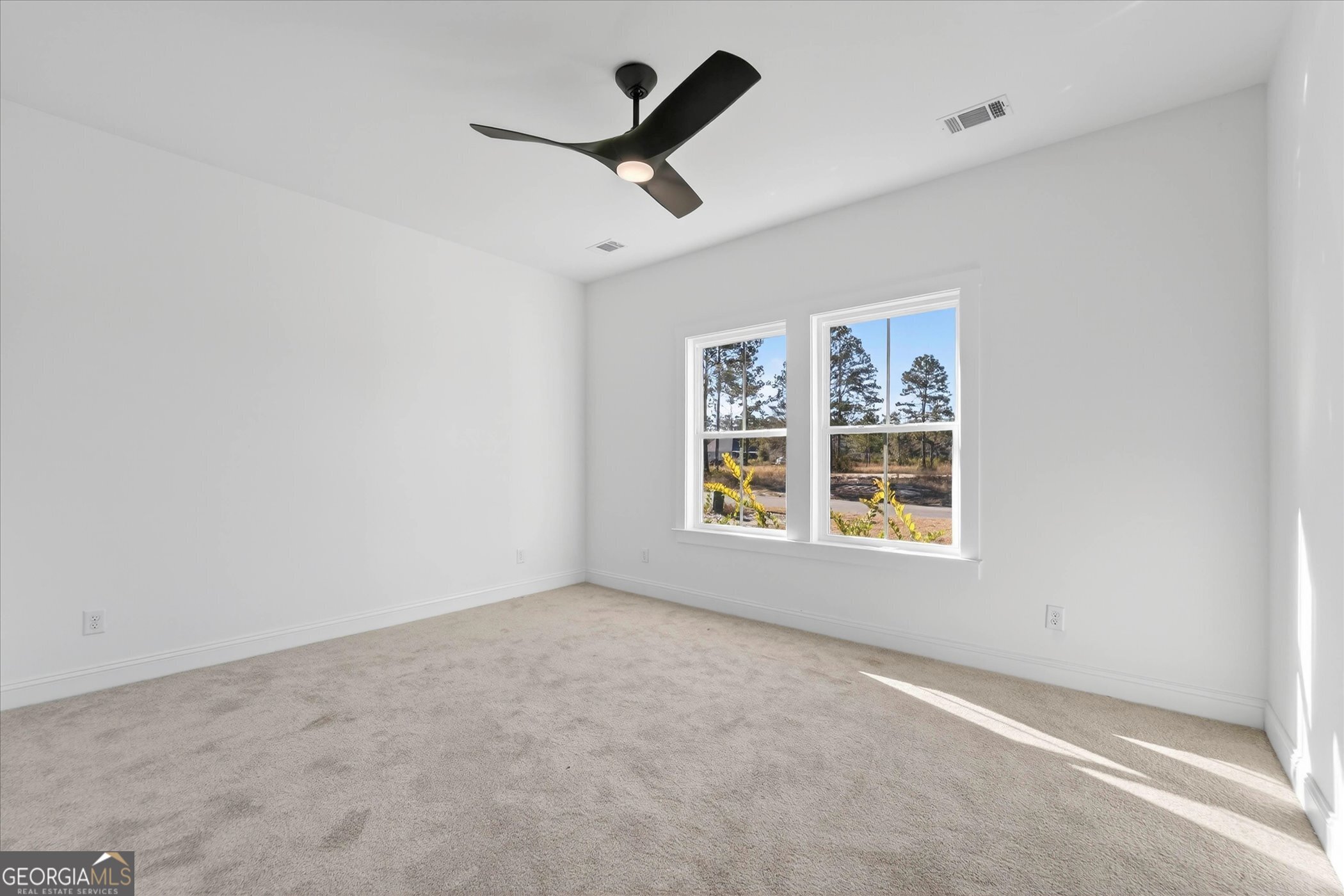 1072 Cottage Way Darien, GA 31305 - Photo 10 of 13 an empty room with a window