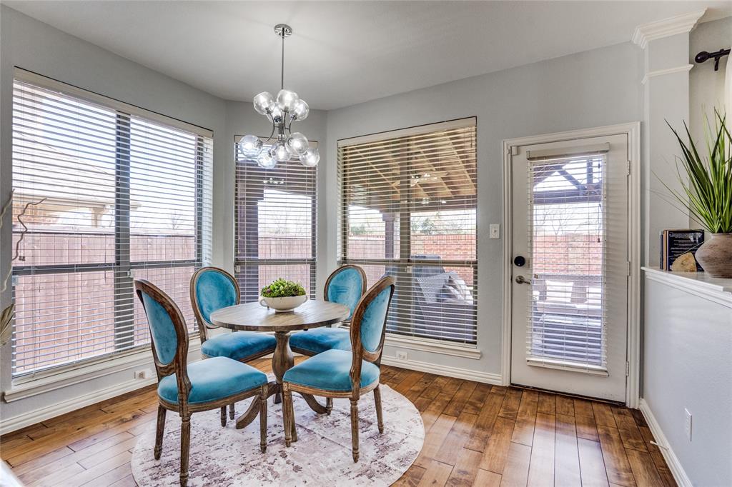 1804 Goodnight Lane Allen, TX 75002 - Photo 19 of 35 Dining room with solid hardwood flooring and a chandelier