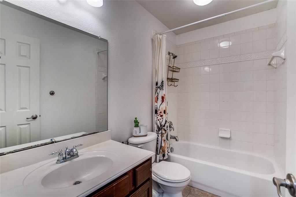 1804 Goodnight Lane Allen, TX 75002 - Photo 27 of 35 Full bath featuring vanity and shower / bathtub combination with curtain