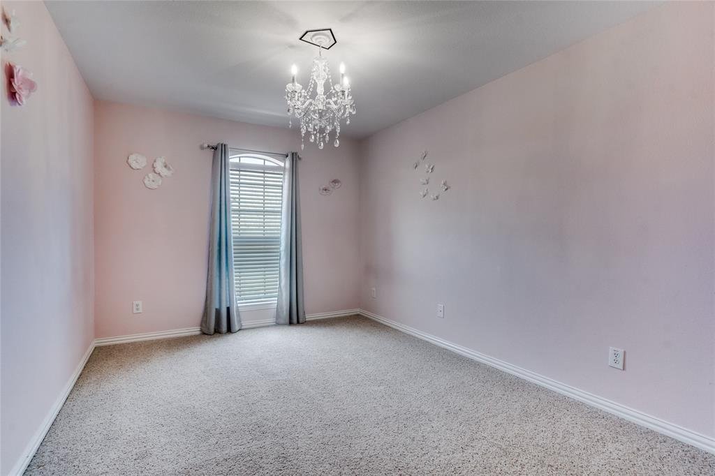1804 Goodnight Lane Allen, TX 75002 - Photo 29 of 35 Empty room featuring light colored carpet and suspended lighting
