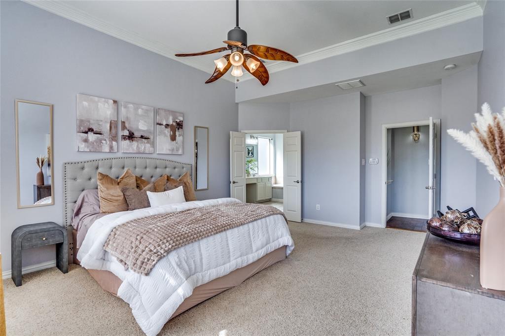 1804 Goodnight Lane Allen, TX 75002 - Photo 32 of 35 Carpeted bedroom with ornamental molding, a ceiling fan, and ensuite bathroom