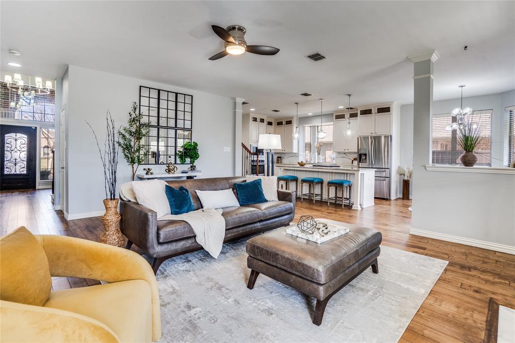 1804 Goodnight Lane Allen, TX 75002 - Photo 9 of 35 Living room featuring ceiling fan, solid hardwood flooring, and a chandelier