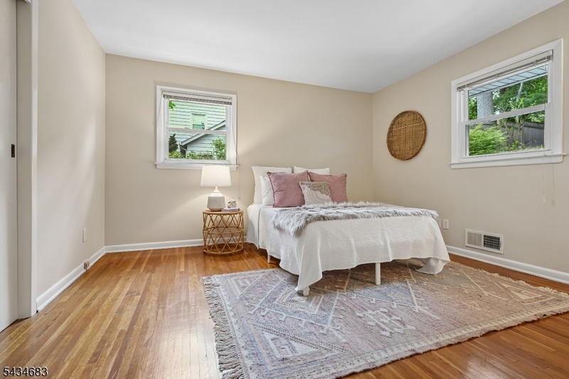 106 Division Avenue Summit, NJ 07901 - Photo 21 of 38 a bedroom with a bed and a window