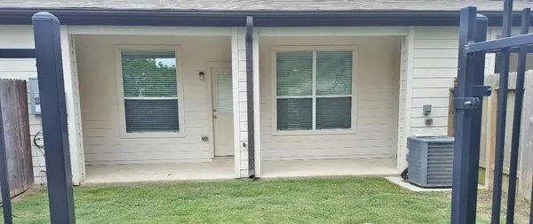 a view of house with backyard