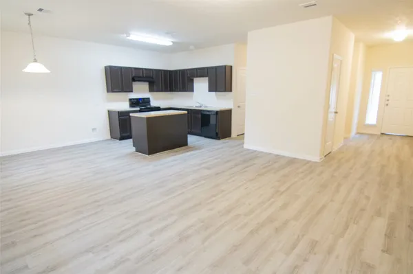 a kitchen with stainless steel appliances a sink and a refrigerator