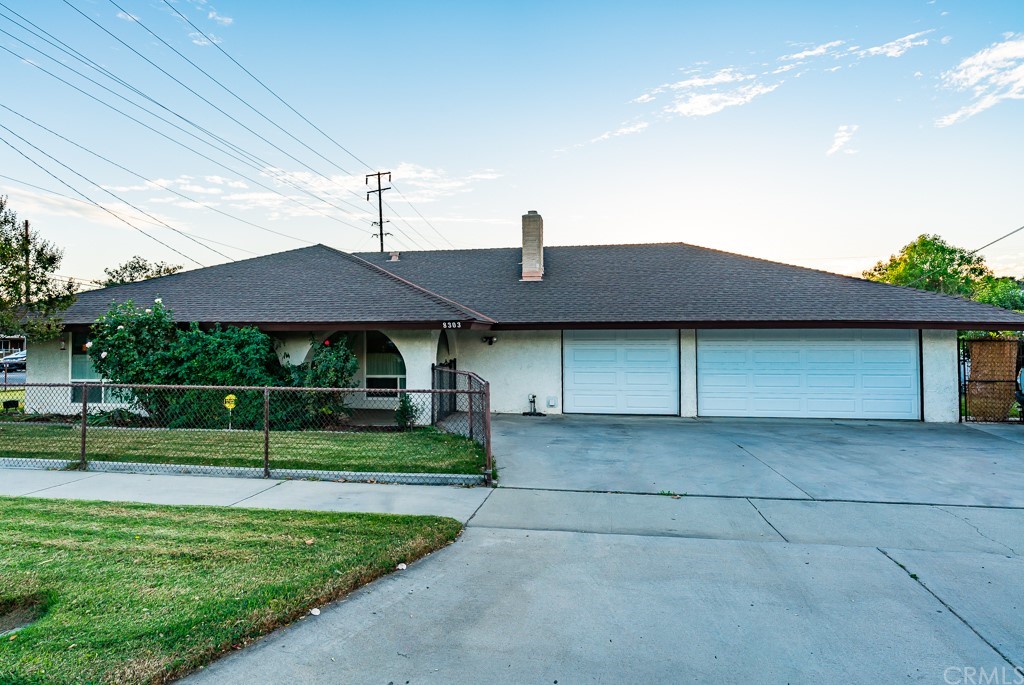 8303 California Avenue Riverside, CA 92504 - Photo 1 of 1 a front view of a house with a yard