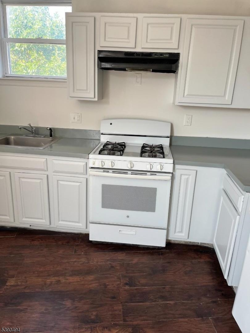 340 Morris Avenue Elizabeth, NJ 07208 - Photo 2 of 8 a white stove top oven sitting inside of a kitchen