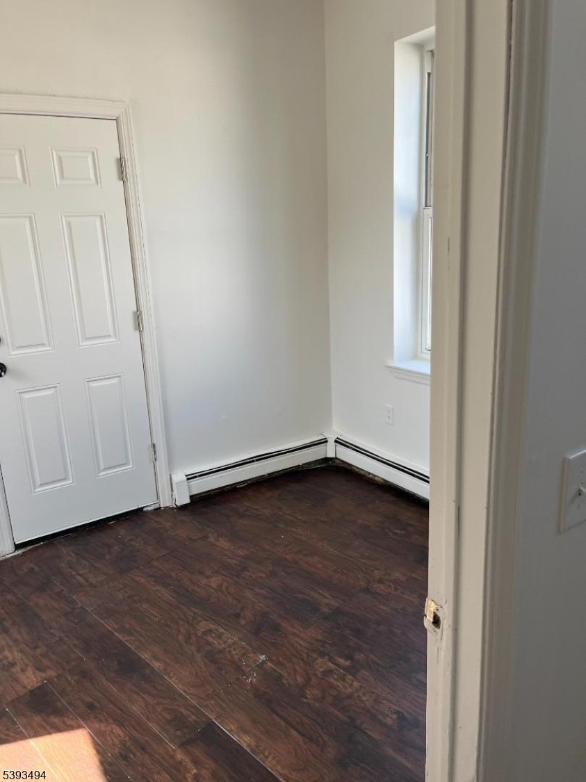 340 Morris Avenue Elizabeth, NJ 07208 - Photo 4 of 8 a view of an empty room with wooden floor