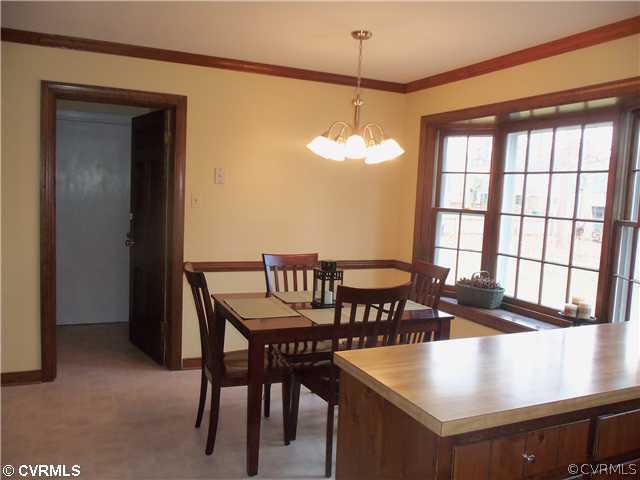 2121 Corner Rock Road Midlothian, VA 23113 - Photo 6 of 12 a view of a dining room with furniture window and outside view