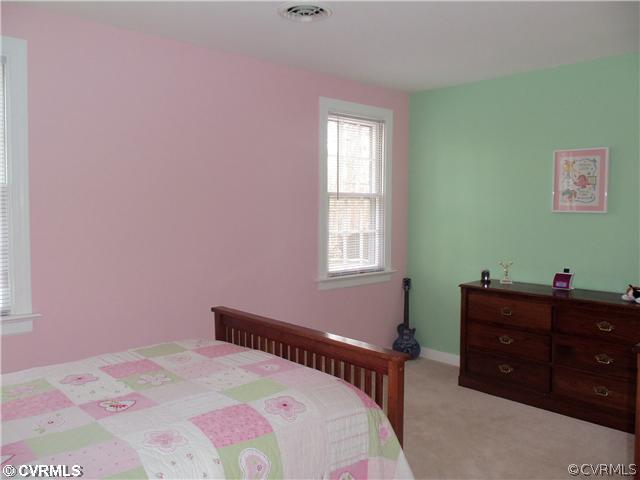 2121 Corner Rock Road Midlothian, VA 23113 - Photo 9 of 12 a bedroom with a bed and a window