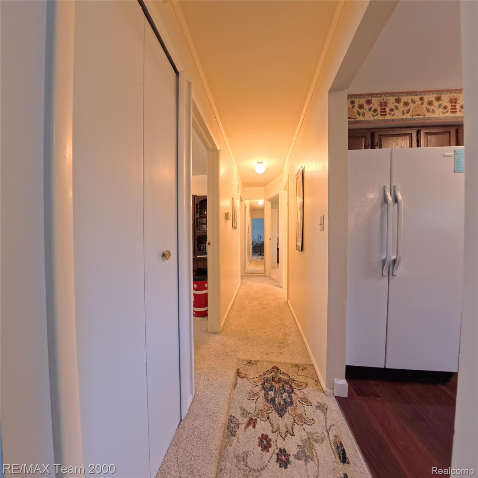 2104 Whittier Road Ypsilanti, MI 48197 - Photo 13 of 45 Hallway featuring light carpet and ornamental molding
