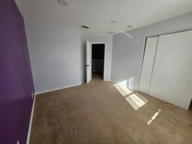 a view of a hallway with windows