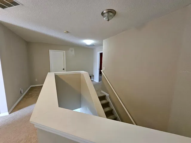 a bathroom with a sink a toilet a mirror and shower