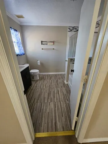 a bathroom with a shower and a toilet