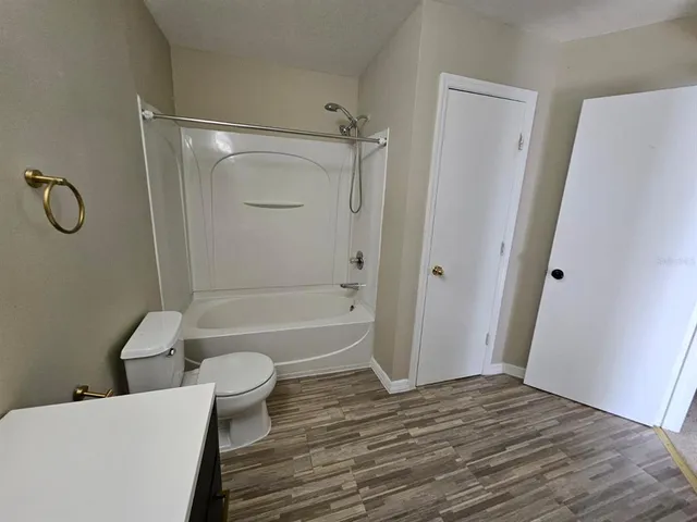 a front view of a house with a garden and plants