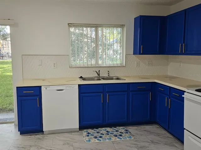a view of wooden cabinets and a sink