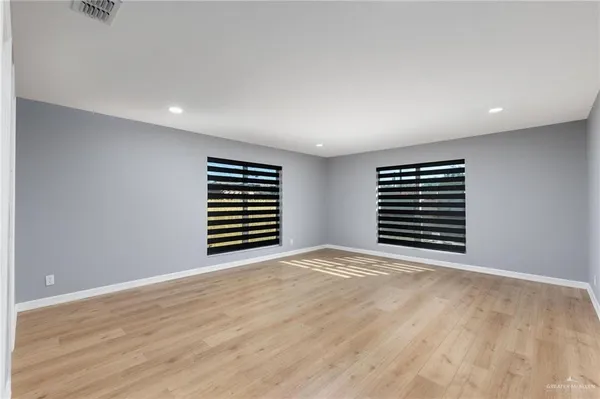 a view of an empty room with a window