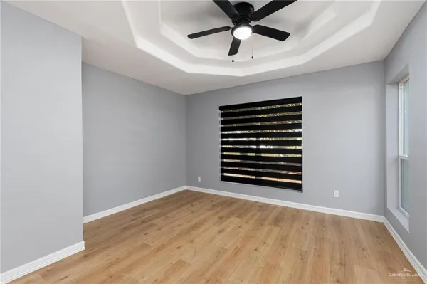 a view of room with a ceiling fan
