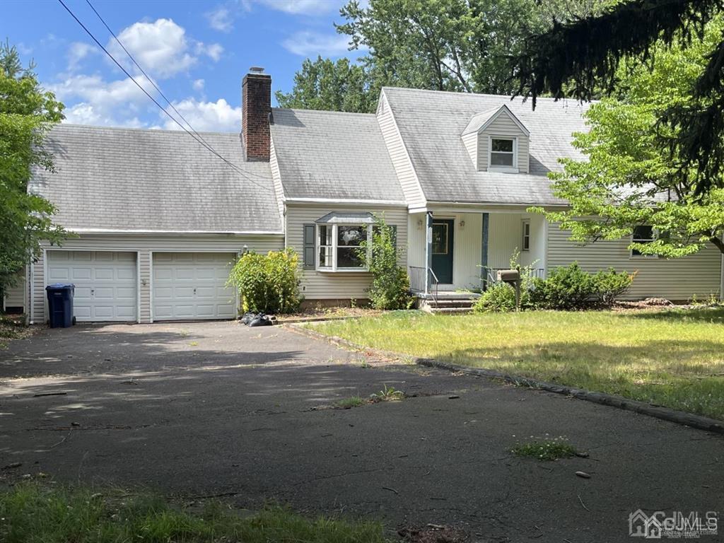 432 Oak Ridge Road Clark, NJ 07066 - Photo 1 of 25 a front view of a house with a yard and garage