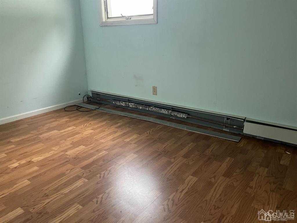 432 Oak Ridge Road Clark, NJ 07066 - Photo 13 of 25 a view of a room with wooden floor and a window