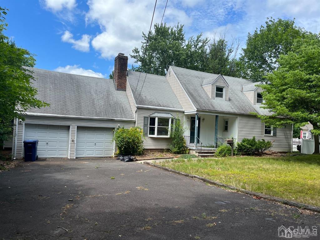 432 Oak Ridge Road Clark, NJ 07066 - Photo 25 of 25 a front view of a house with a yard and garage