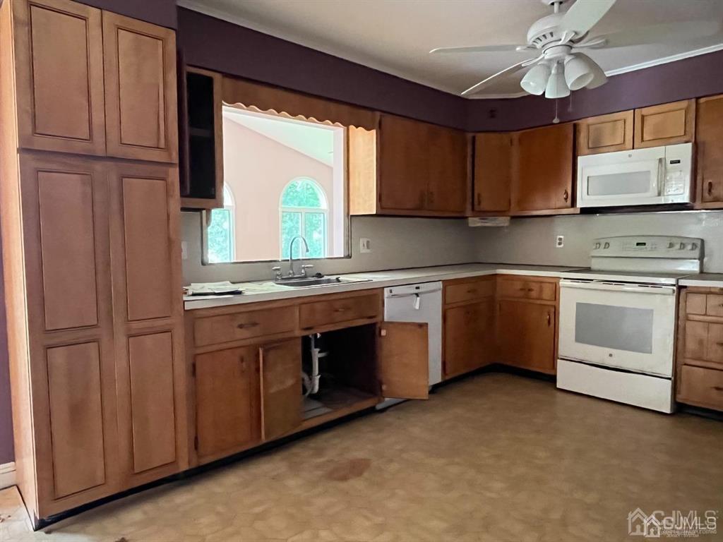 432 Oak Ridge Road Clark, NJ 07066 - Photo 3 of 25 a kitchen with stainless steel appliances granite countertop a stove sink and cabinets