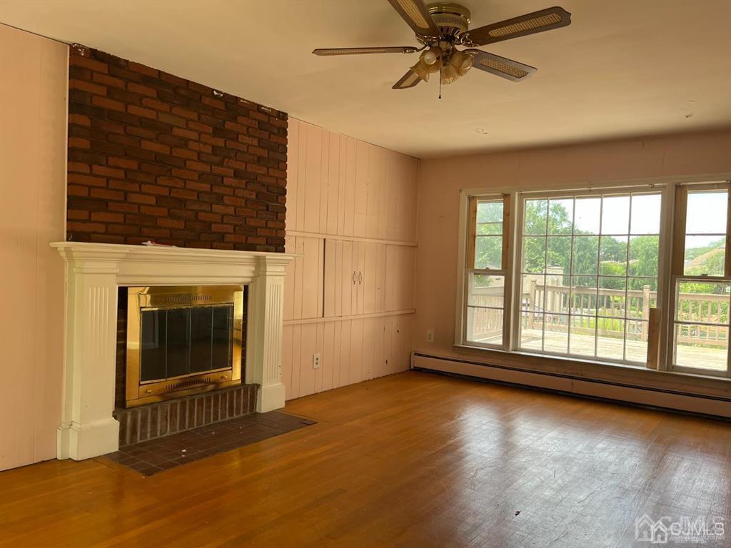 432 Oak Ridge Road Clark, NJ 07066 - Photo 8 of 25 a view of a livingroom with a fireplace and window