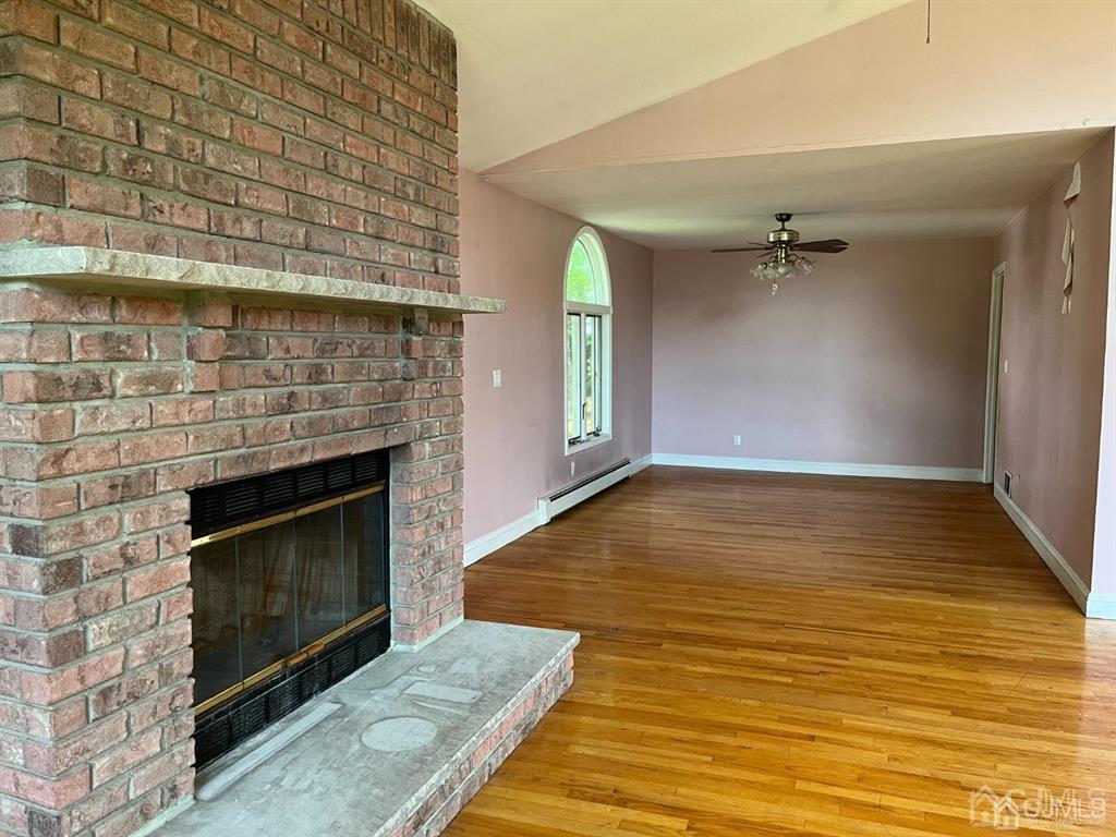 432 Oak Ridge Road Clark, NJ 07066 - Photo 10 of 25 a view of an empty room with a fireplace