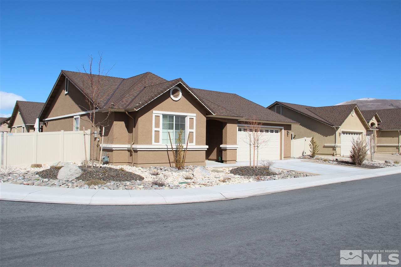 a front view of a house with a wooden fence