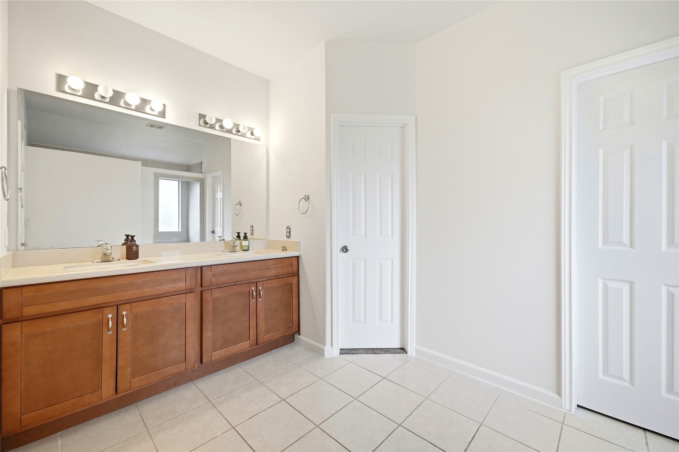 5411 Gate Canyon Court Spring, TX 77373 - Photo 21 of 33 a spacious bathroom with a double vanity sink mirror and
