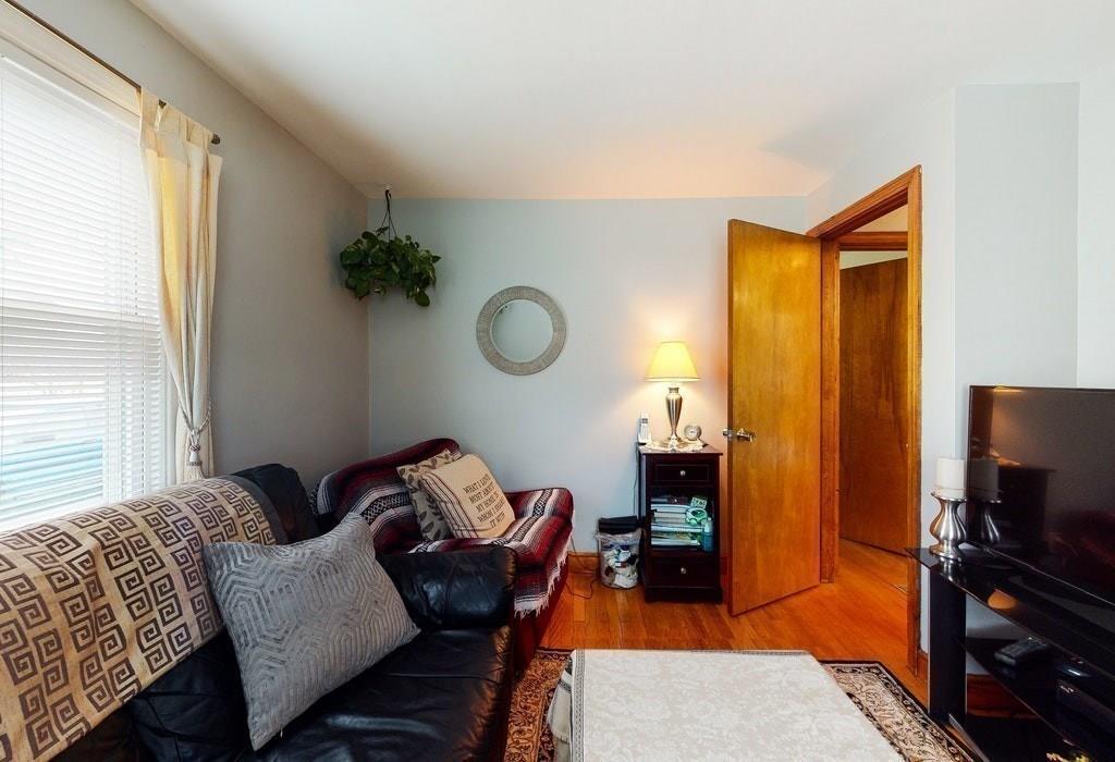 2 Wadsworth Road Arlington, MA 02476 - Photo 12 of 24 a living room with furniture and a fireplace