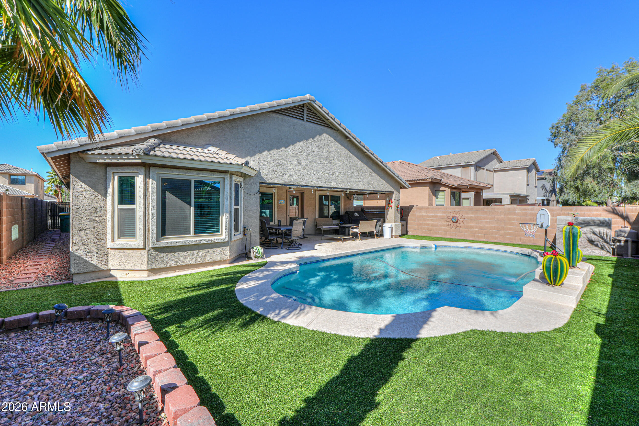 43843 Roth Road Maricopa, AZ 85138 - Photo 45 of 53 a view of a house with a yard patio and swimming pool