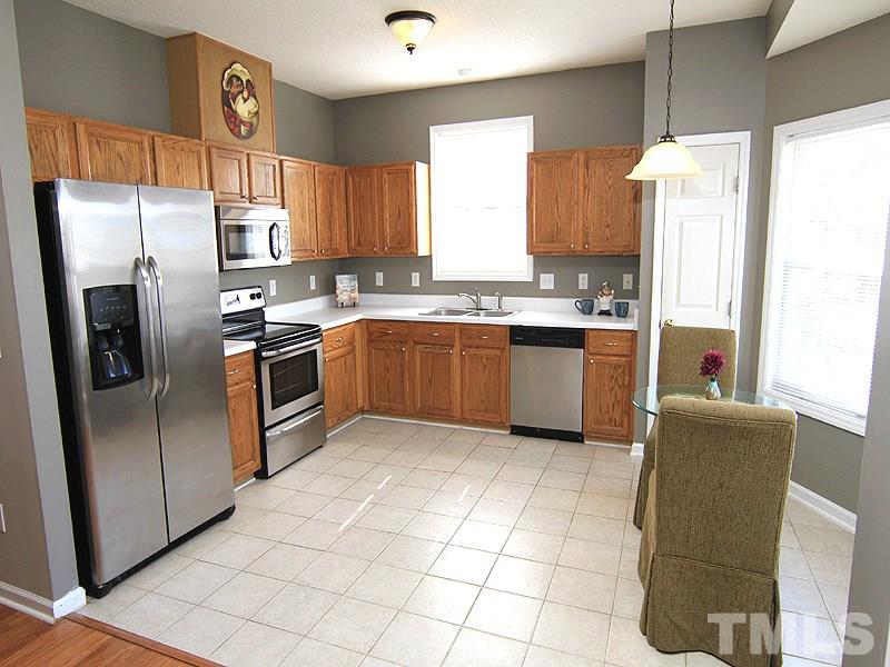 2109 Timken Court Raleigh, NC 27604 - Photo 7 of 21 a kitchen with stainless steel appliances granite countertop a refrigerator a stove a sink dishwasher and a refrigerator