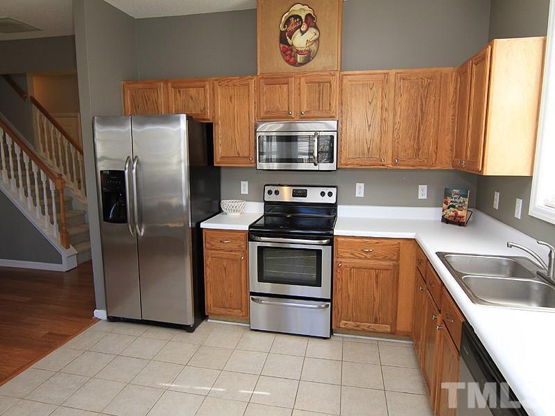 2109 Timken Court Raleigh, NC 27604 - Photo 9 of 21 a kitchen with stainless steel appliances granite countertop a refrigerator sink and stove