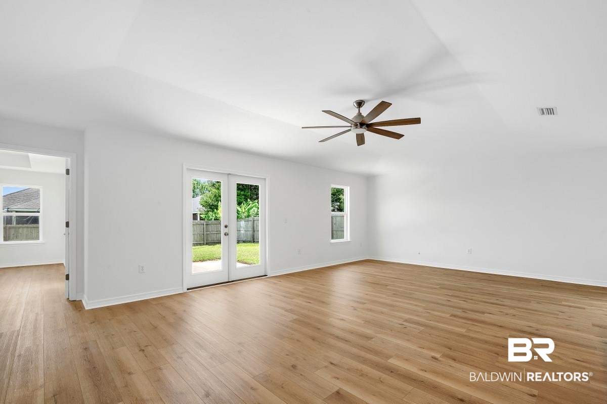 16927 Sugar Loop Foley, AL 36535 - Photo 3 of 50 Empty room featuring ceiling fan and light wood finished floors