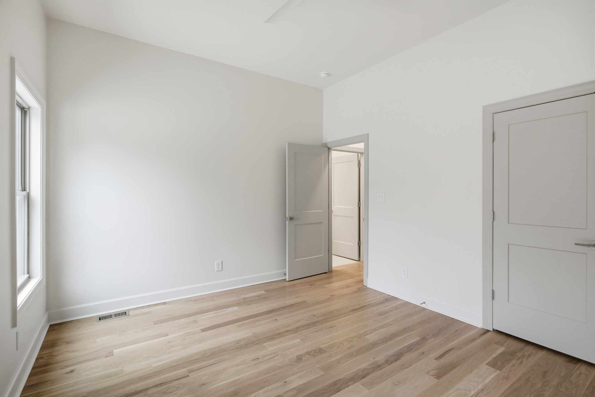 2957 Pace Road Clarksville, TN 37043 - Photo 27 of 77 an empty room with wooden floor and windows