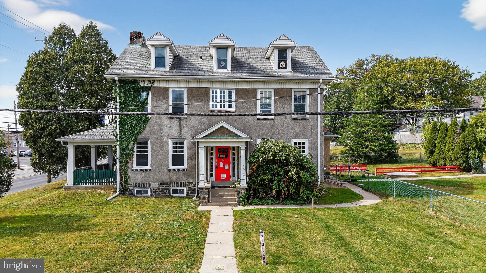 223 East Park Road Havertown, PA 19083 - Photo 2 of 43 a front view of a house with a yard table and chairs