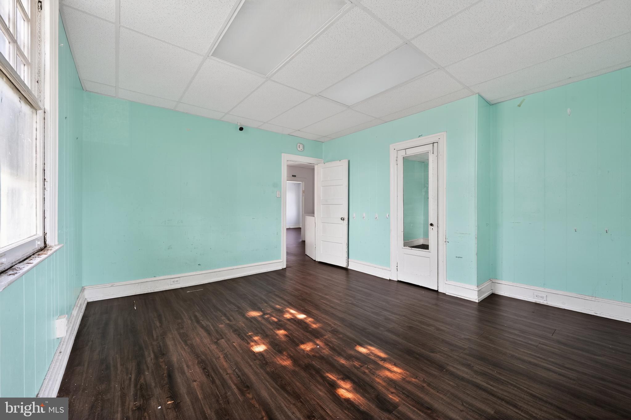 223 East Park Road Havertown, PA 19083 - Photo 22 of 43 an empty room with wooden floor and windows