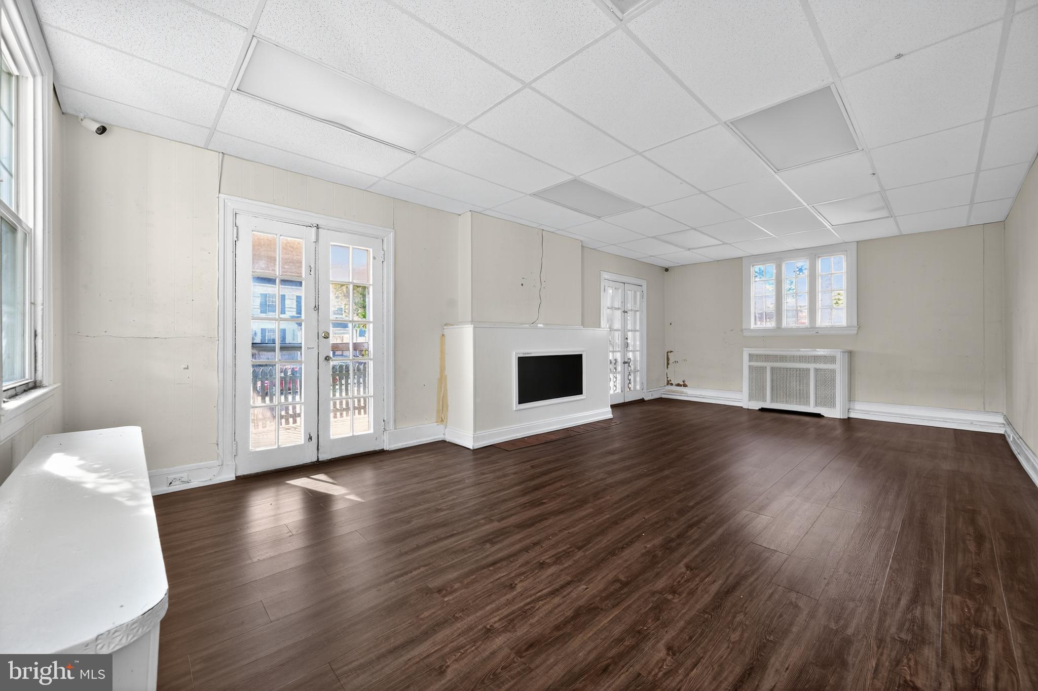 223 East Park Road Havertown, PA 19083 - Photo 25 of 43 a view of a livingroom with wooden floor and a fireplace