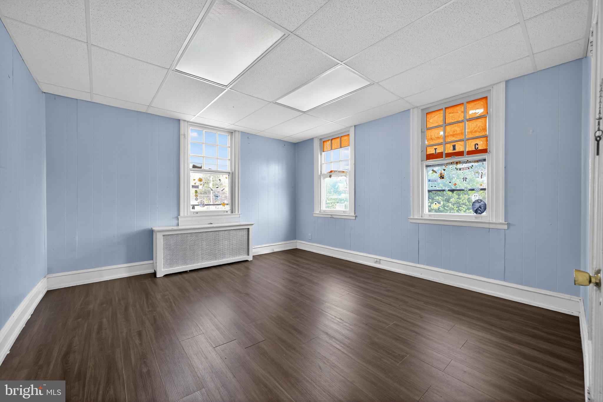 223 East Park Road Havertown, PA 19083 - Photo 28 of 43 an empty room with wooden floor and windows